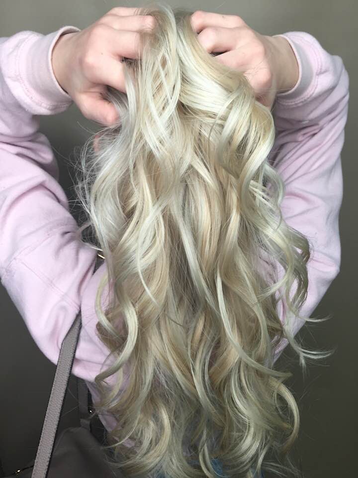 Long blonde curly hair at hairstyle inn saskatoon
