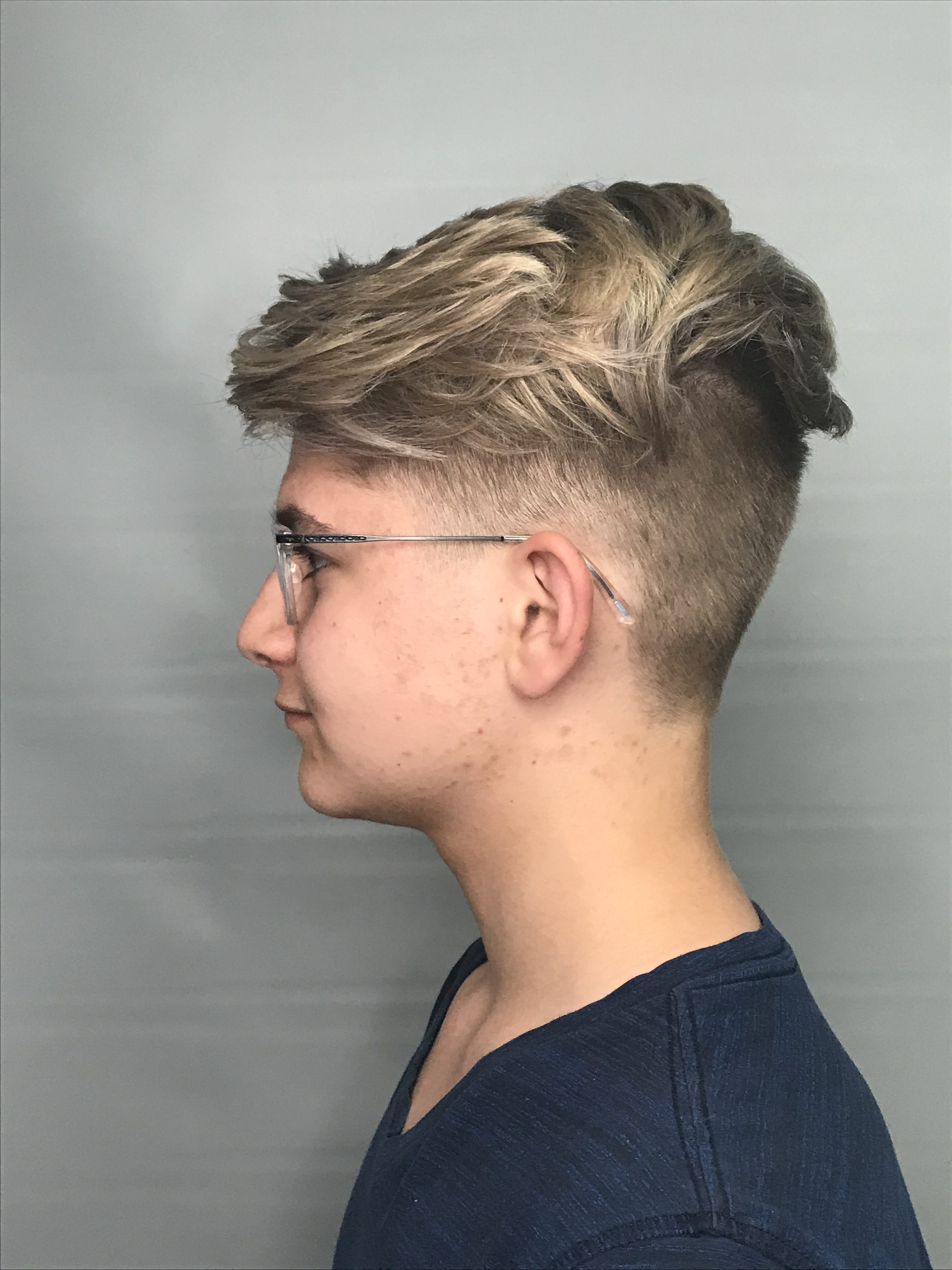 Side view of male customer with side hair cut