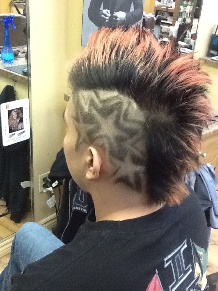 Back left angle view of male customer hair cut with tattoo at hairstyle inn Saskatoon