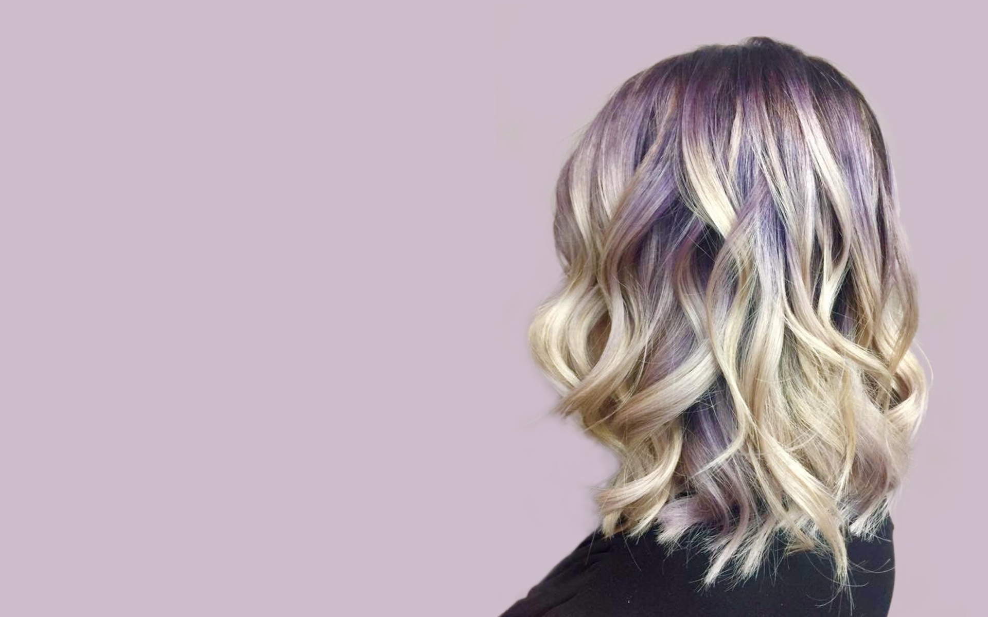 Female customer with curly highlights hair Saskatoon